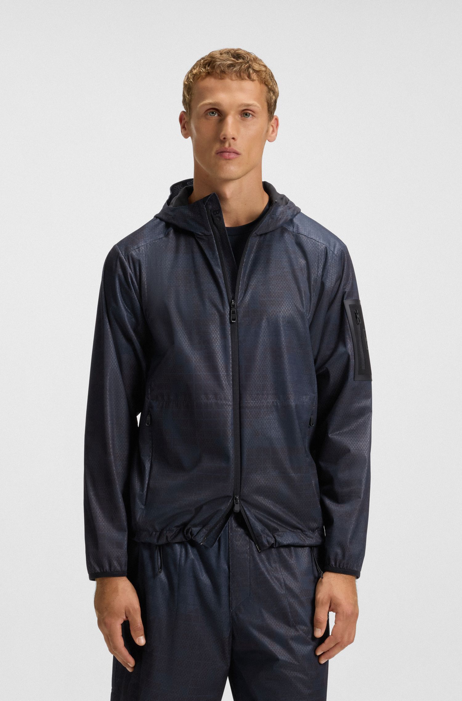Áo khoác parka thể thao có mũ in họa tiết toàn bộ