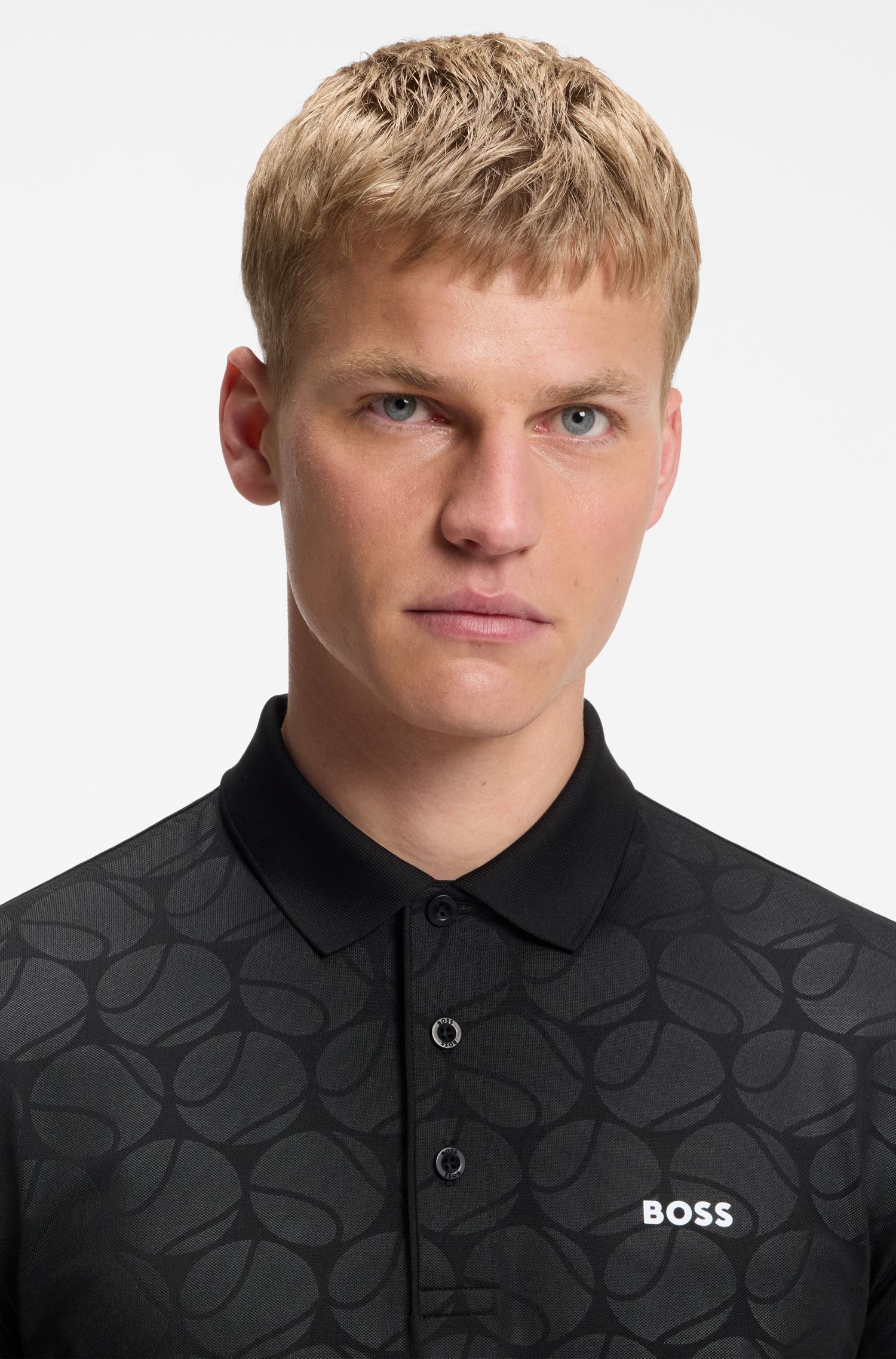 BOSS - Áo polo dáng ôm năng động với họa tiết quả bóng tennis dập nổi.
