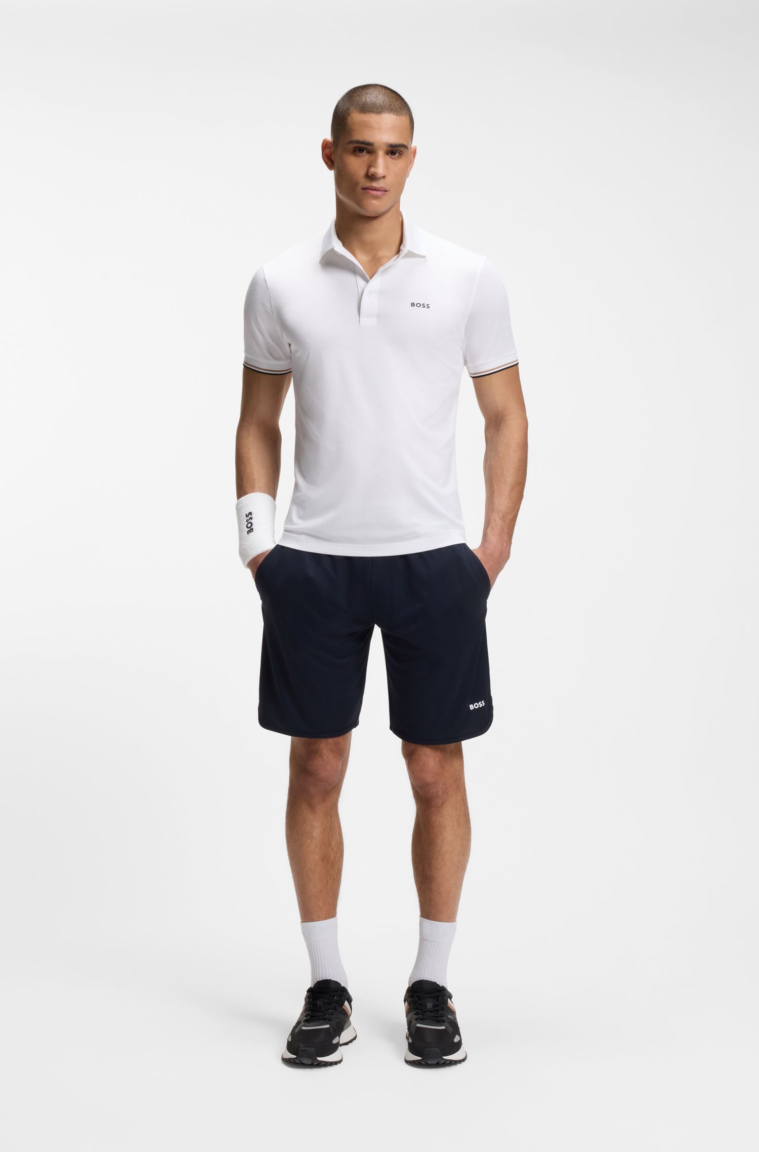BOSS - Áo polo dáng ôm năng động với họa tiết quả bóng tennis dập nổi.