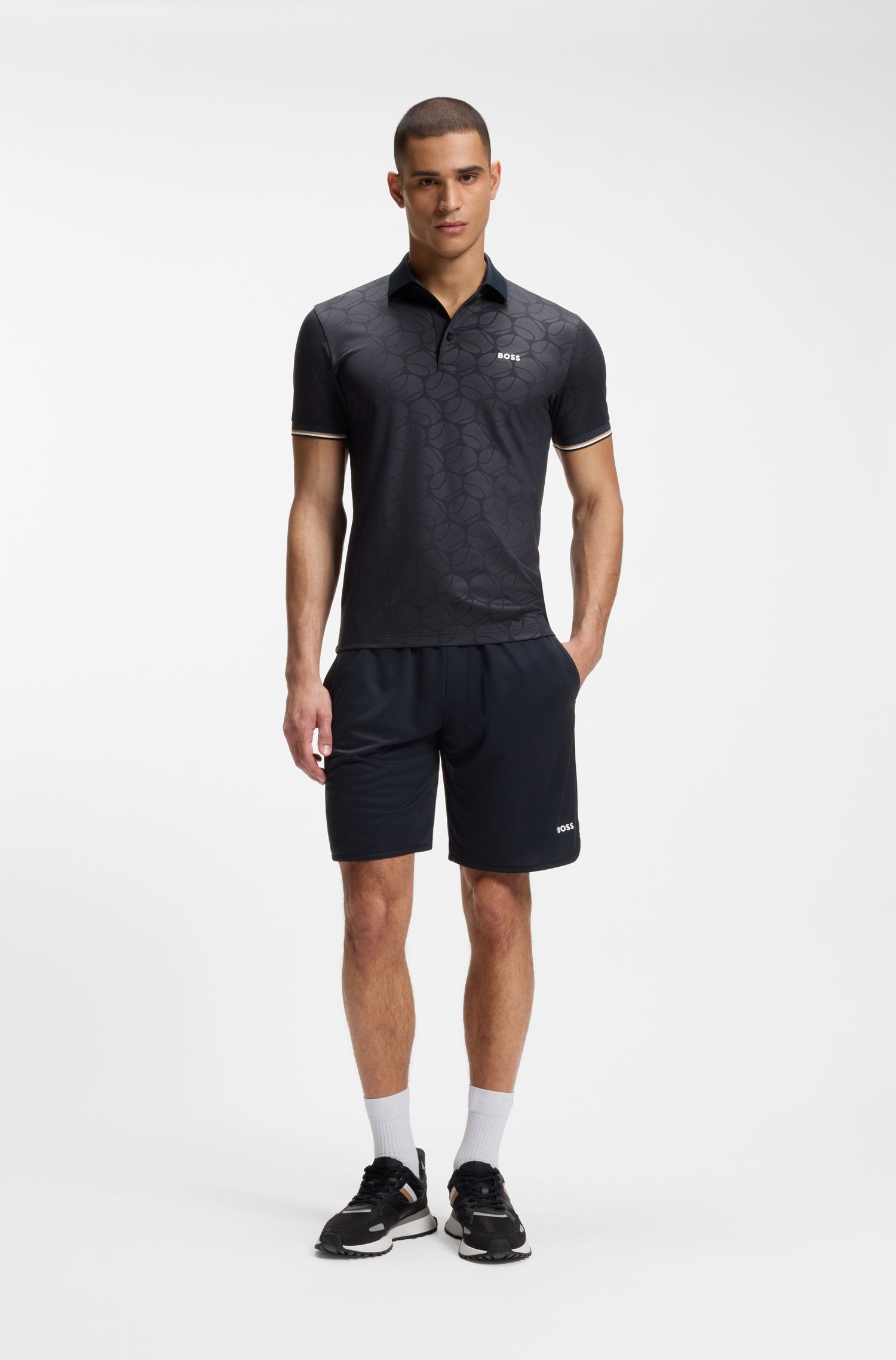 BOSS - Áo polo dáng ôm năng động với họa tiết quả bóng tennis dập nổi.