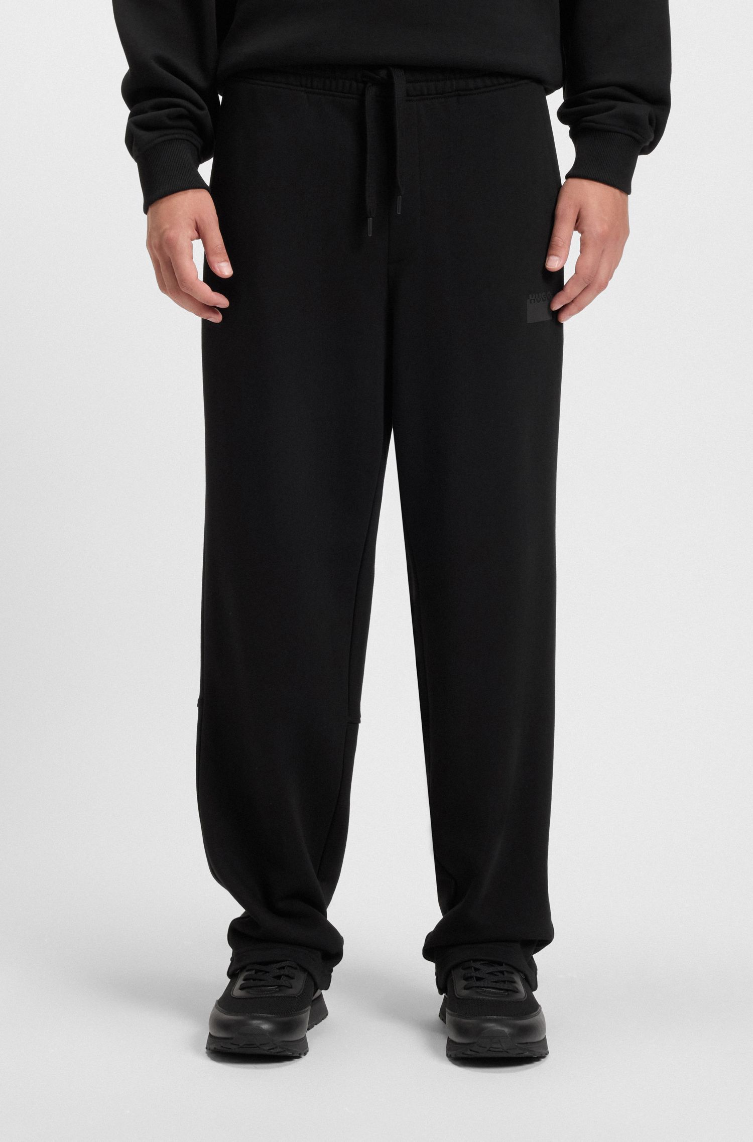 Quần sweatpants cotton terry in logo cắt đôi