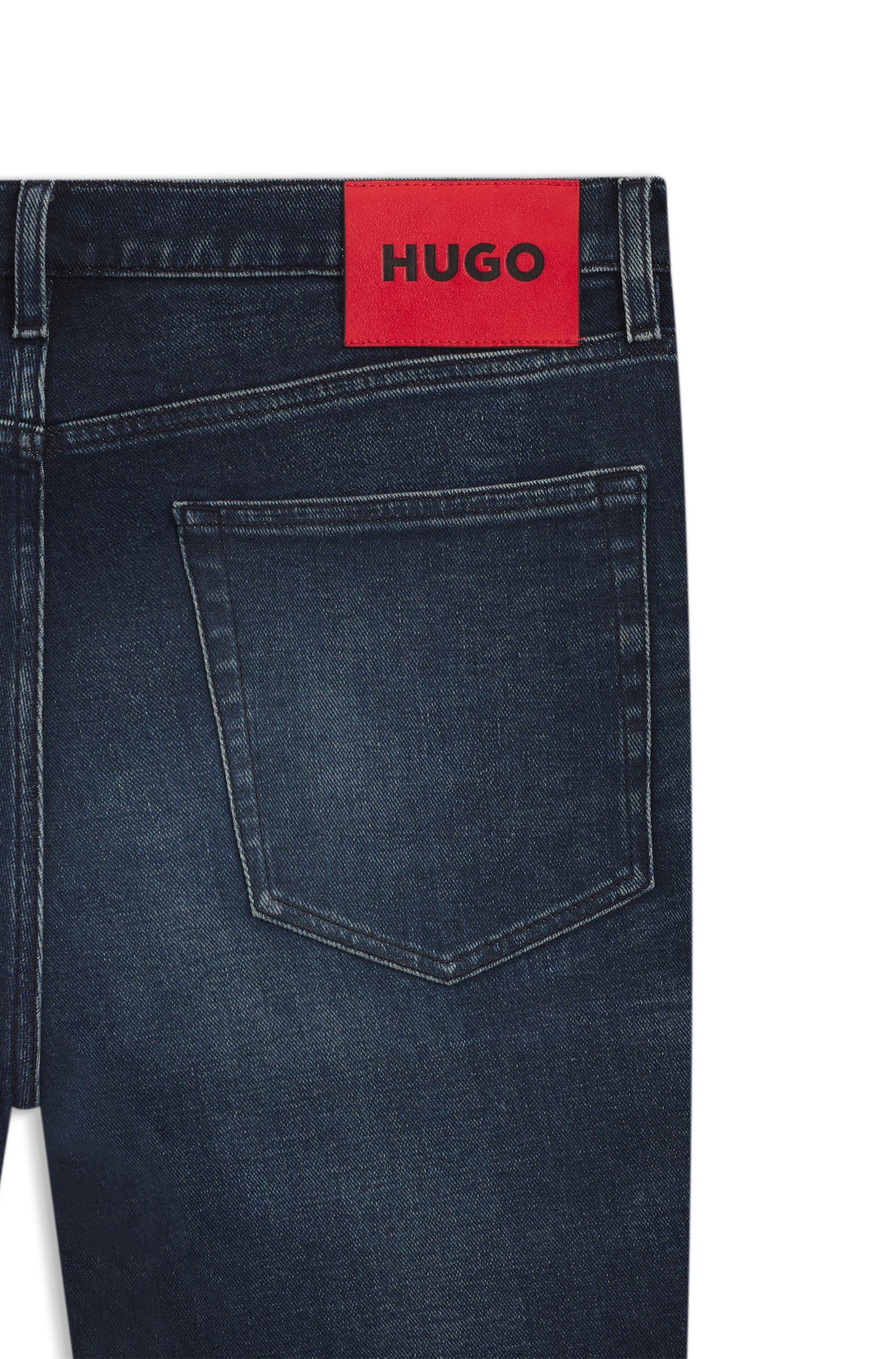 HUGO - Quần jeans dáng ôm sát màu xanh đậm, chất liệu denim co giãn.