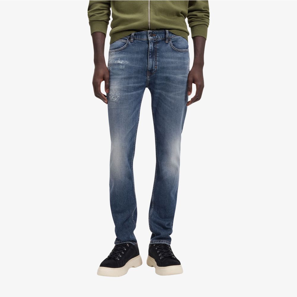 Quần jeans slim-fit màu xanh đậm, chất liệu denim co giãn thoải mái