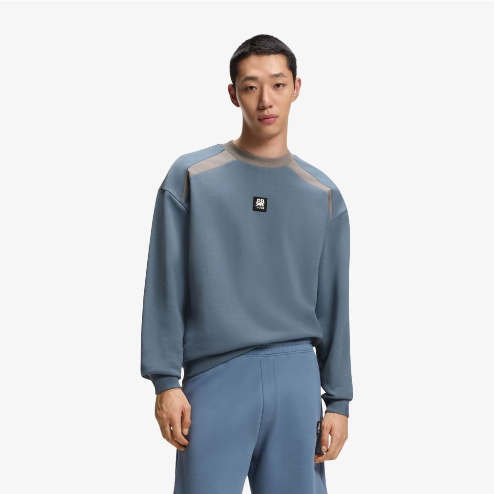 Áo nỉ cotton terry Hugo x RB với họa tiết bò tót