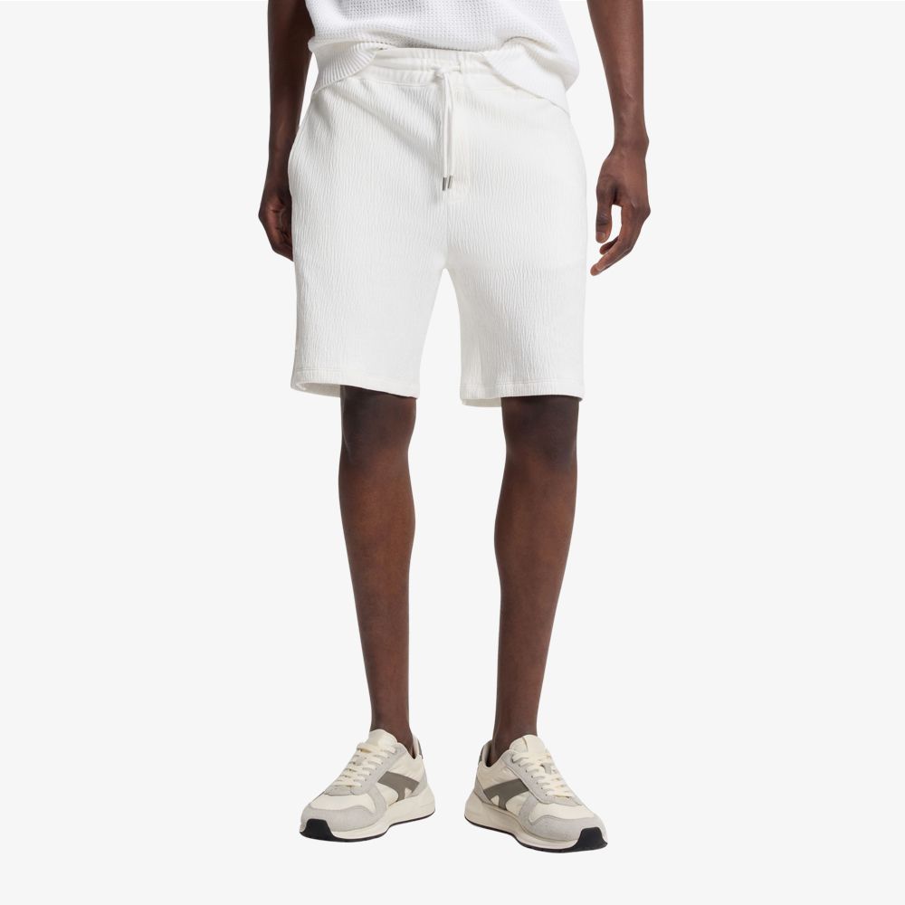 HUGO - Quần short cotton co giãn với hiệu ứng nhăn.