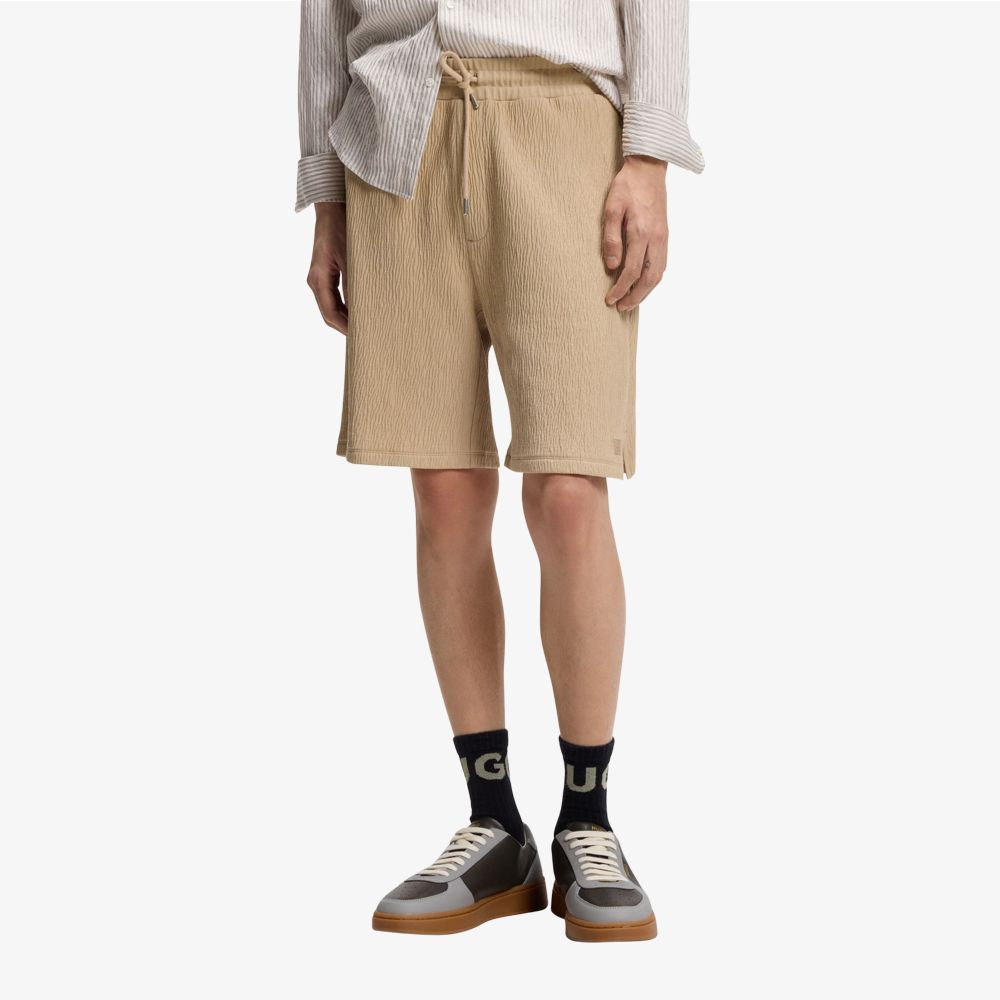 HUGO - Quần short cotton co giãn với hiệu ứng nhăn.