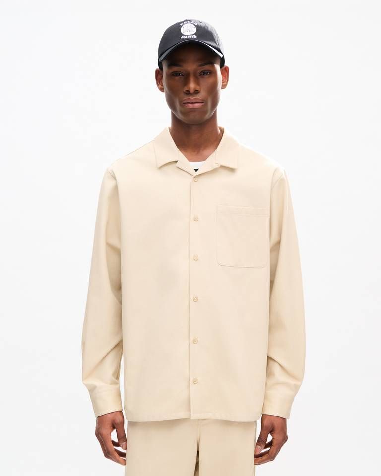 Áo sơ mi dáng rộng đặc trưng của KENZO, chất liệu cotton họa tiết xương cá.