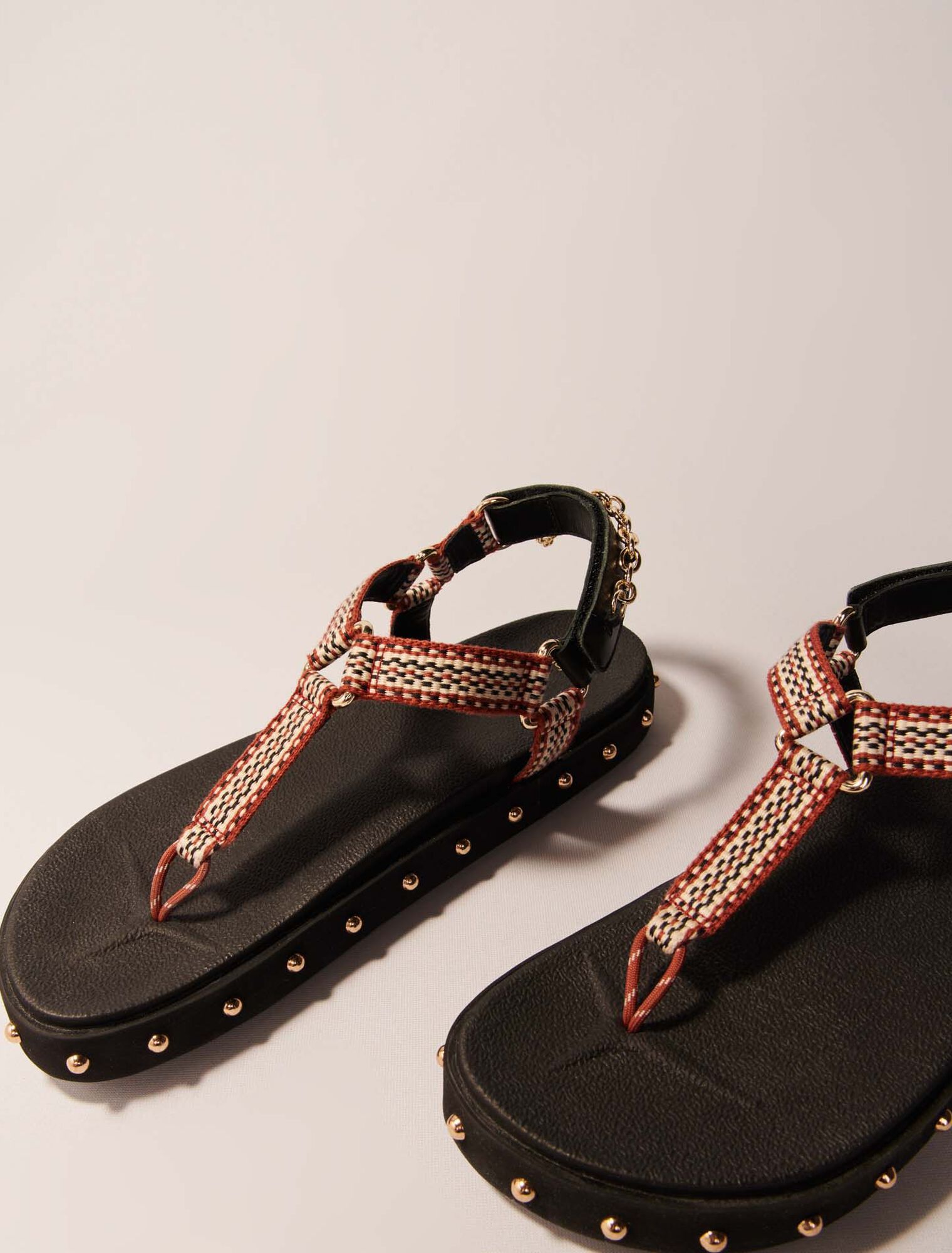 Maje - Dép sandal da đinh tán phối dây thổ cẩm