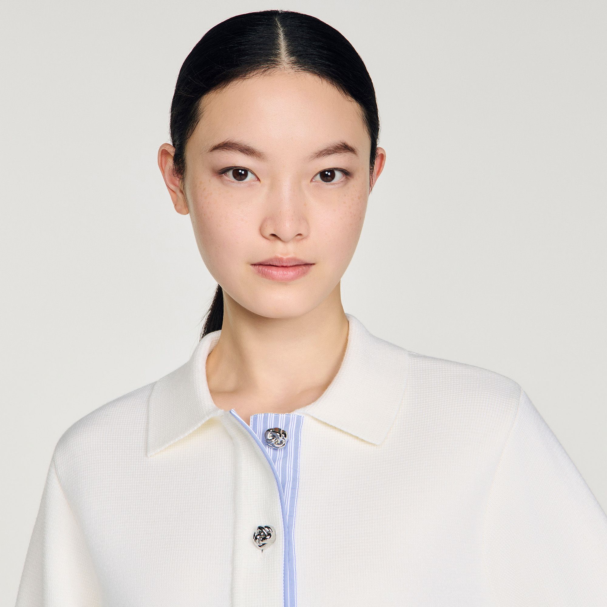 Sandro - Áo khoác polo chi tiết vải poplin.